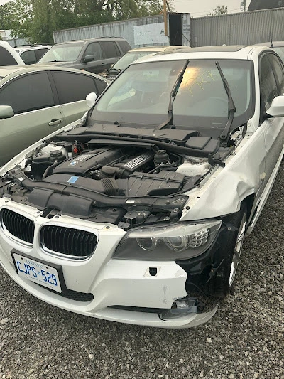 Damaged white BMW 3 Series junk car removal in North York, Toronto