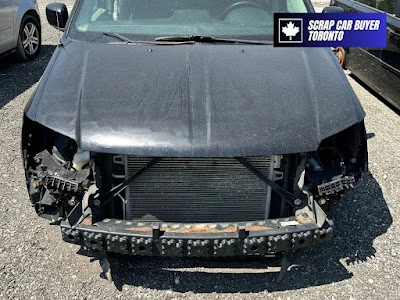 junk car buyer North York Heavily damaged black junk car North York Toronto