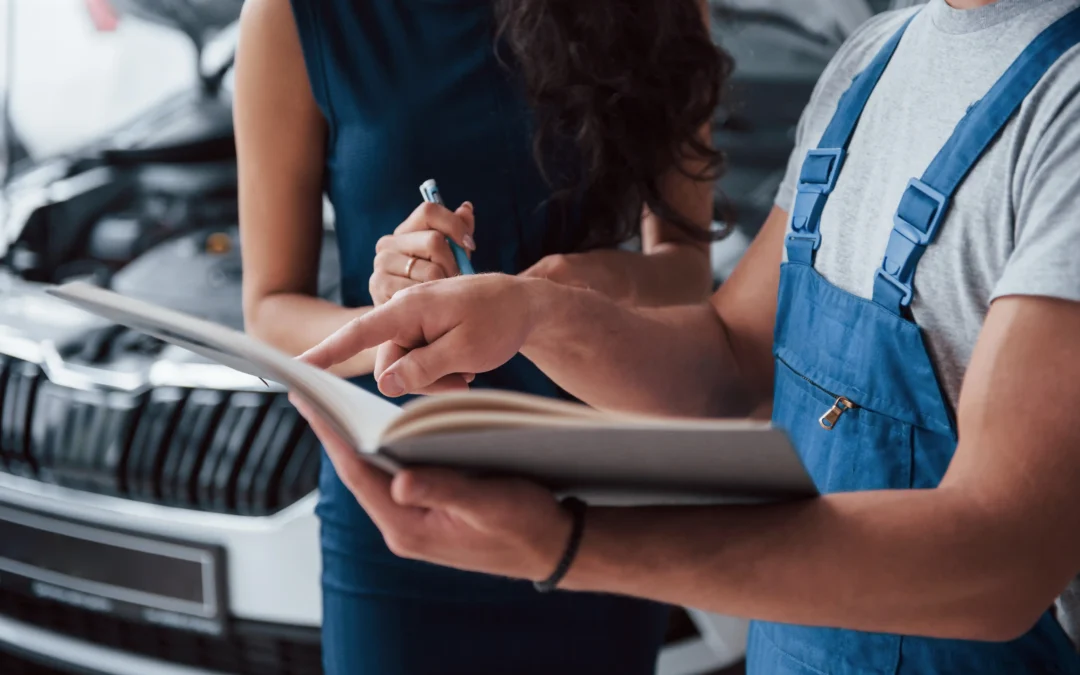Junk car buyer reviewing vehicle history paperwork with seller during scrap car verification process