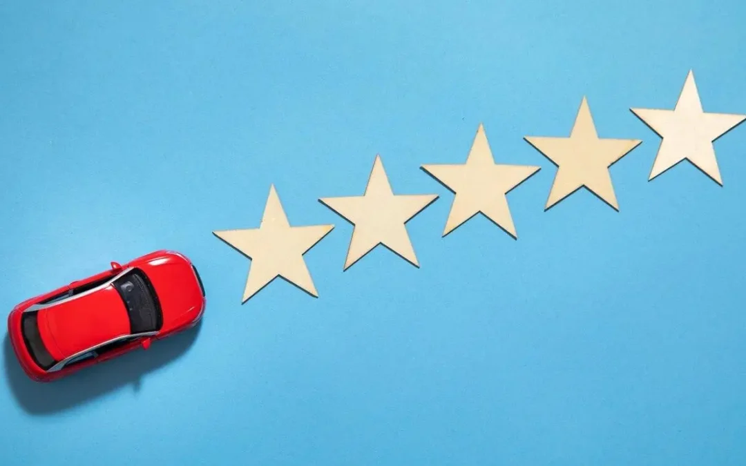 A red car approaches five stars, symbolizing the journey toward excellent customer reviews and service quality.